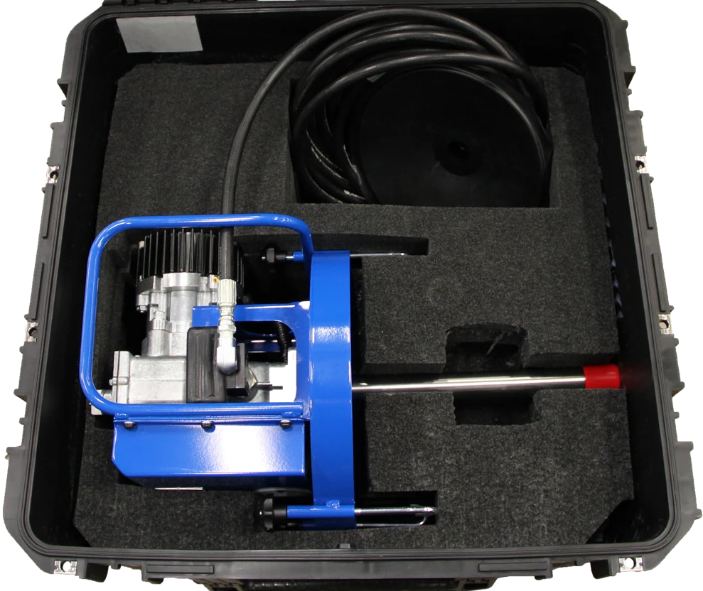 Open Windlube shipping case with the pump assembly and hose fitted into the foam interior